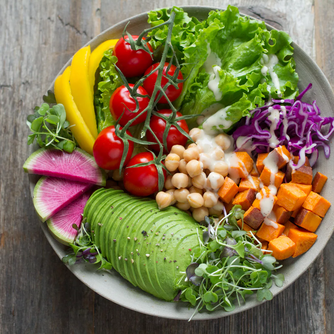 A bowl of roasted vegetables and grains